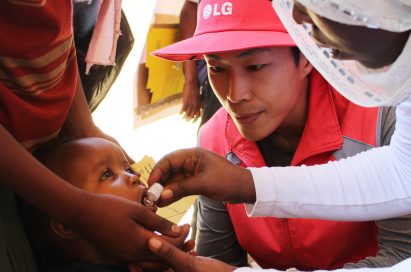 A child gets an oral cholera vaccination.