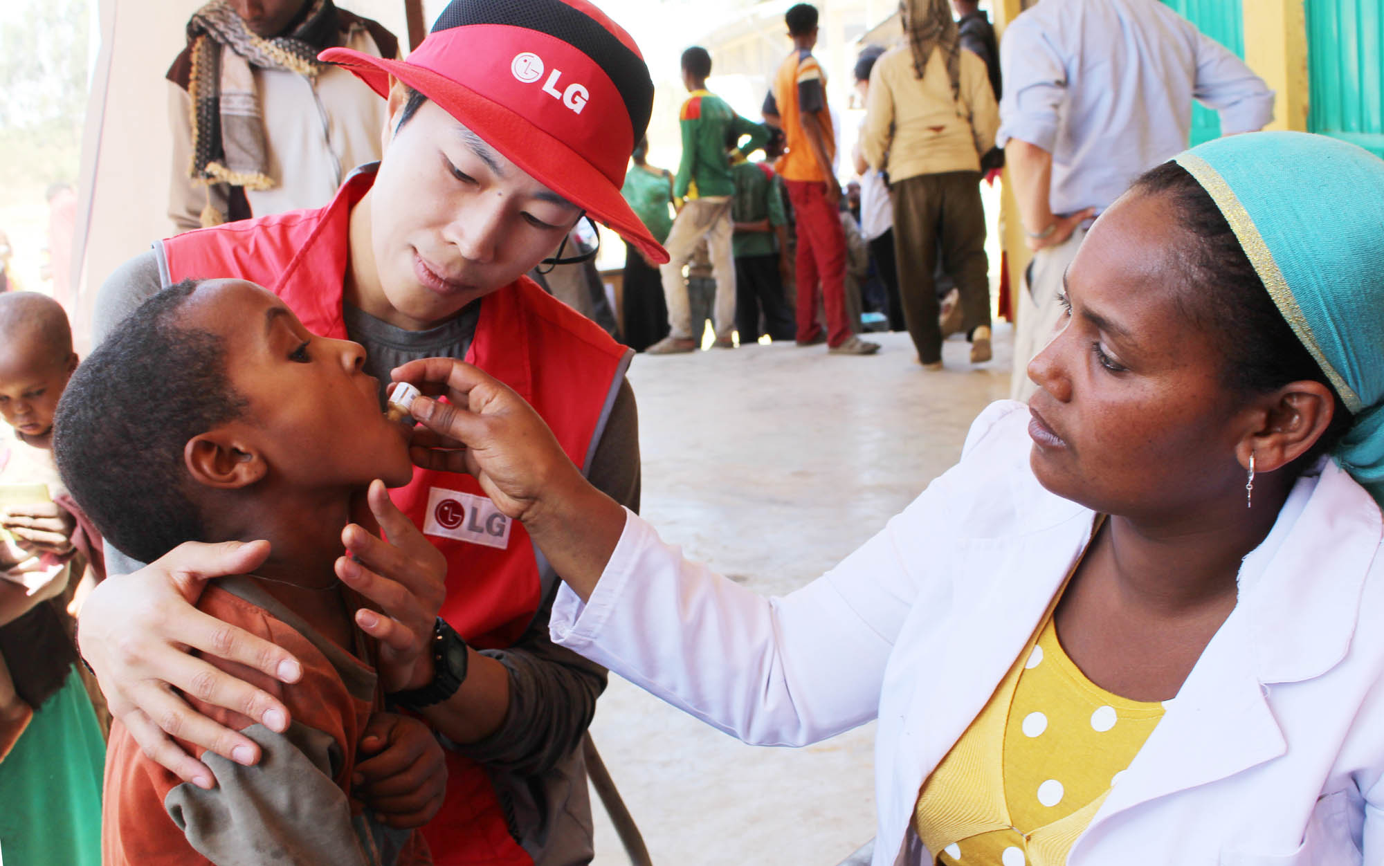A child gets an oral cholera vaccination.
