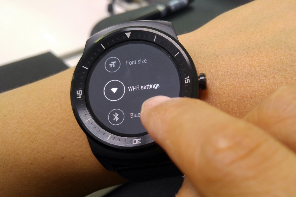 A user of LG G watch is trying to choose the Wi-Fi settings menu on his or her watch.