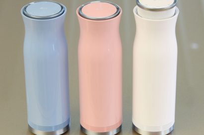Three side-by-side LG SoundPop 360 models in pink, white and light blue