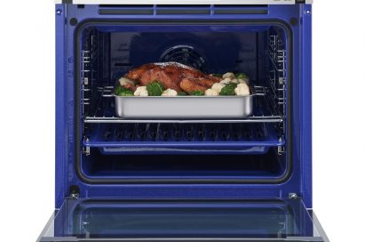 LG Studio oven with door opened and cooked food inside
