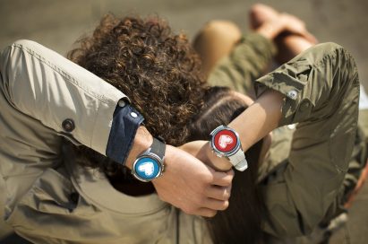 A man and woman are holding hands with the LG Watch Urbane 2nd Edition on both their wrists