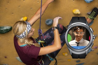 A woman looks at the LG Watch Urbane 2nd Edition on her wrist to receive an incoming call while rock climbing