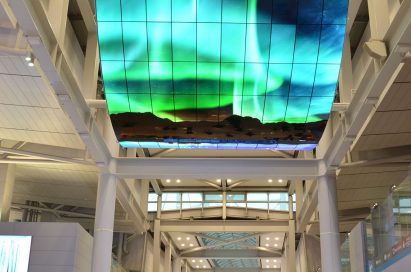 A ceiling installation of LG OLED Signage delivering the wonders of the aurora borealis to travelers at Incheon International Airport