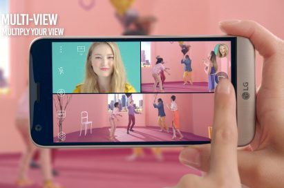 A girl takes a selfie and pictures of the scene in front of her simultaneously with the LG G5’s Multi View feature