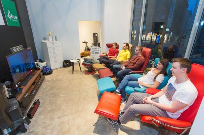 Five participants watch TV on one of LG’s OLED TVs during their TV-watching marathon