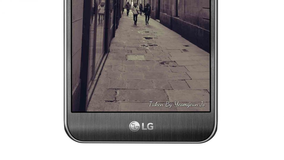 A woman is being photographed by a man with the LG X cam in White