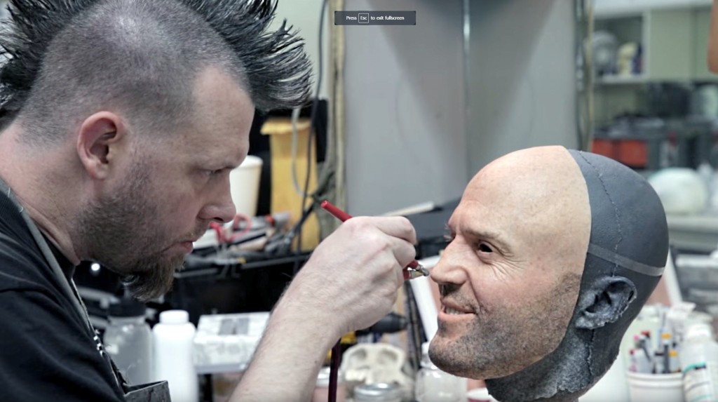 A man airbrushes a face mask of Jason Statham used during filming of LG G5 TV Commercial, ‘World of Play’