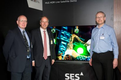 Officials of LG, BBC and SES pose in front of an LG OLED TV at the ninth SES Industry Days conference in Luxembourg