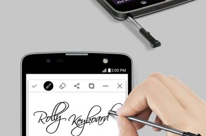 A person using the stylus to write ‘Rolly Keyboard’ in cursive on the LG Stylus 2 Plus