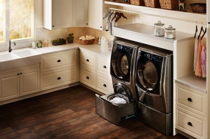 LG Styler and set of TWINWash™ washing machine and dryer fitted into a utility room.