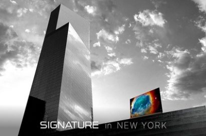 LG SIGNATURE OLED TV with Picture-on-Glass design next to the reflective glass of 4 World Trade Center building in New York