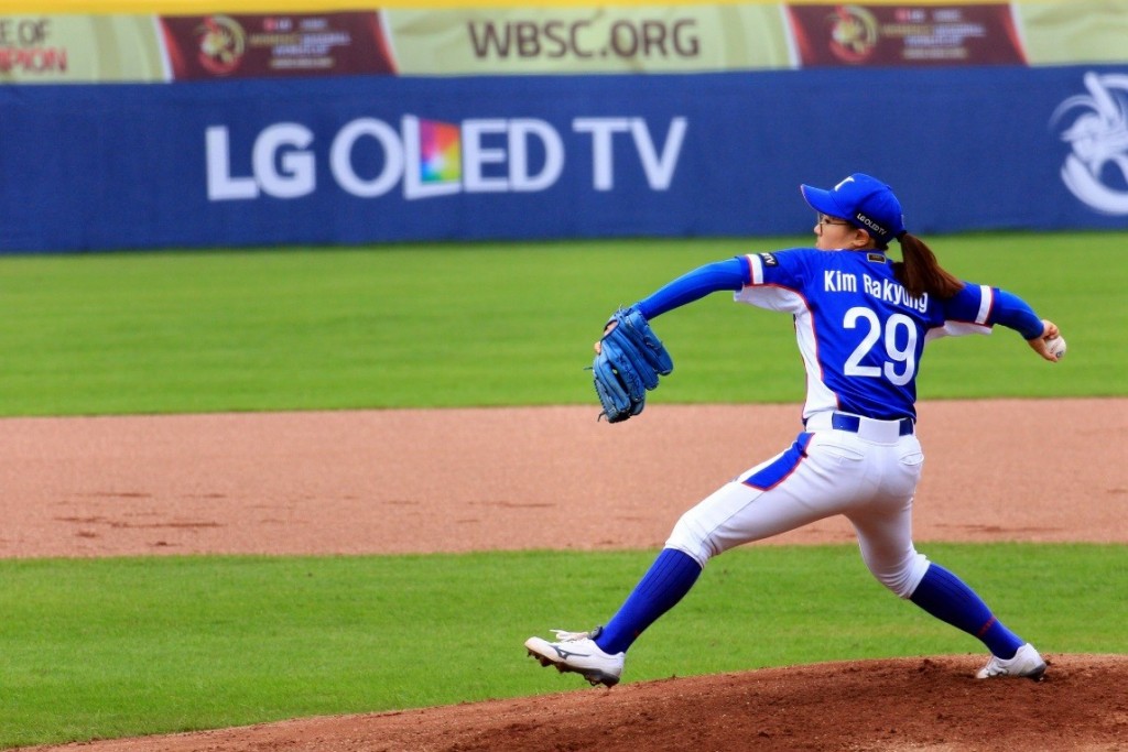 South Korean player pitching with LG OLED TV logo visible in background