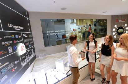 Male and female models and visitors at LG booth in IFA 2019