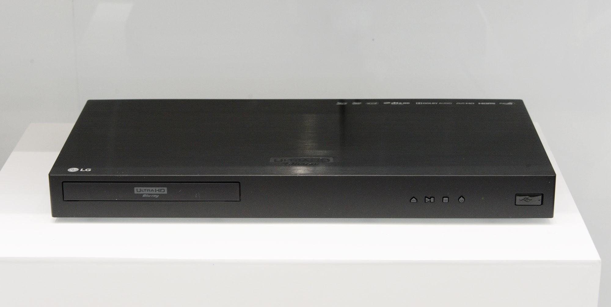 Front view of the LG UP970 Ultra HD Blu-ray player on a white table