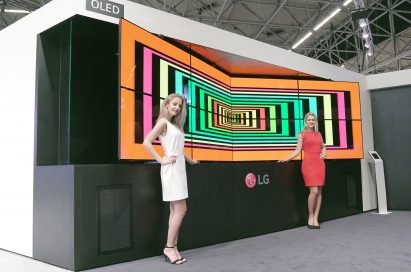 Two models are presenting LG Flexible Open Frame OLED Singage