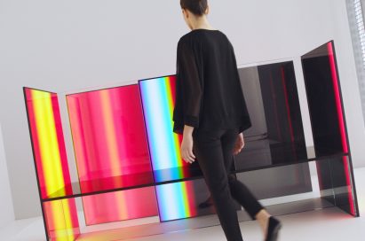 A woman beholds Tokujin Yoshioka's OLED panel installation artwork.