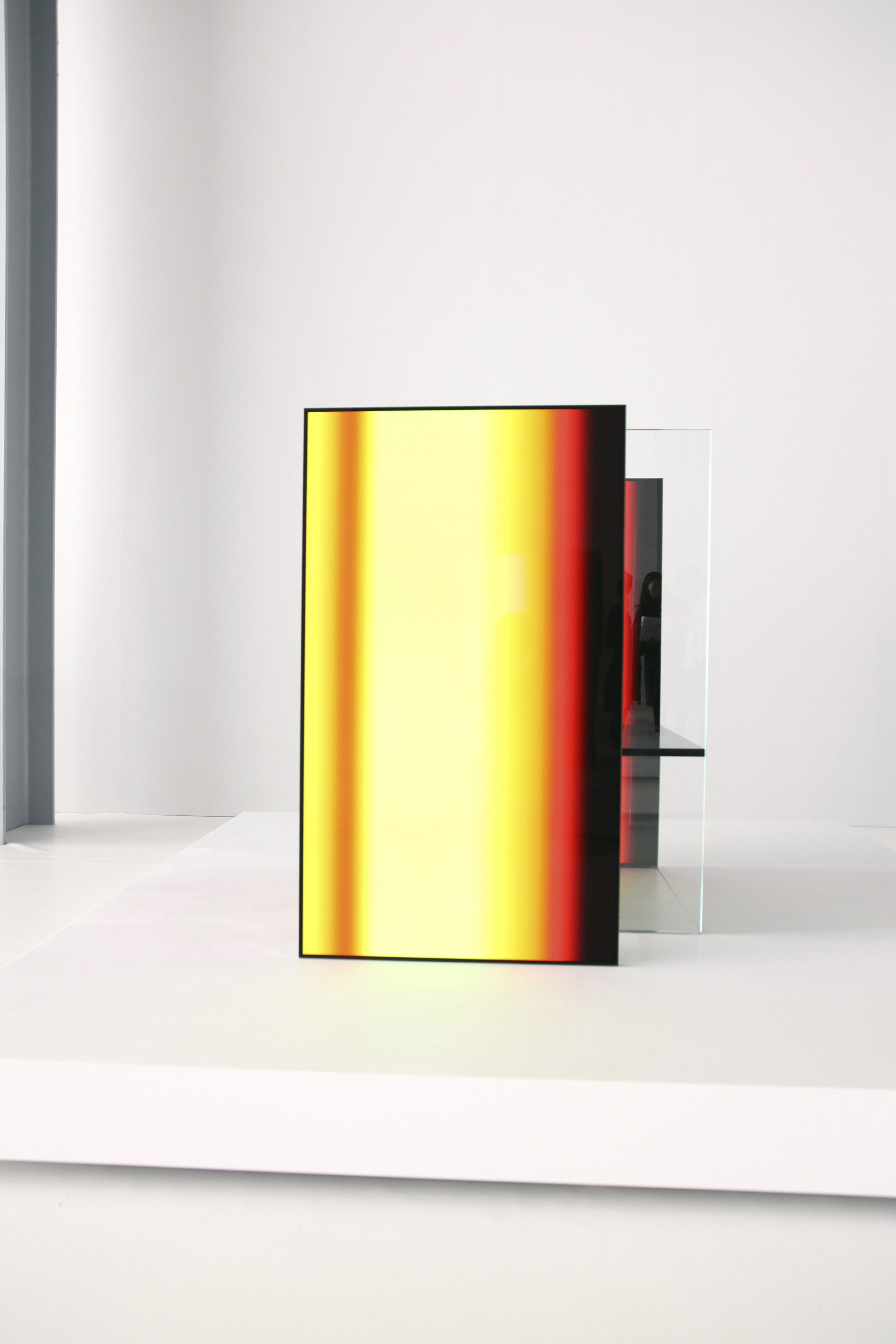 A front close-up of one of the OLED panel installations found inside Tokujin Yoshioka’s art exhibition, currently displaying vibrant yellows and reds.