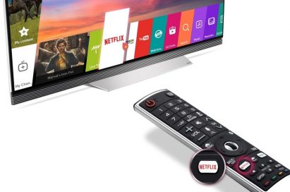 2017 LG OLED TV with Netflix app selected, shown next to Magic Remote with magnified image of Netflix shortcut button