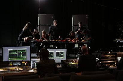 The London Vegetable Orchestra record music using the vegetable instruments they made from LG refrigerated food, with two displayed in the background and a music studio overlooking.