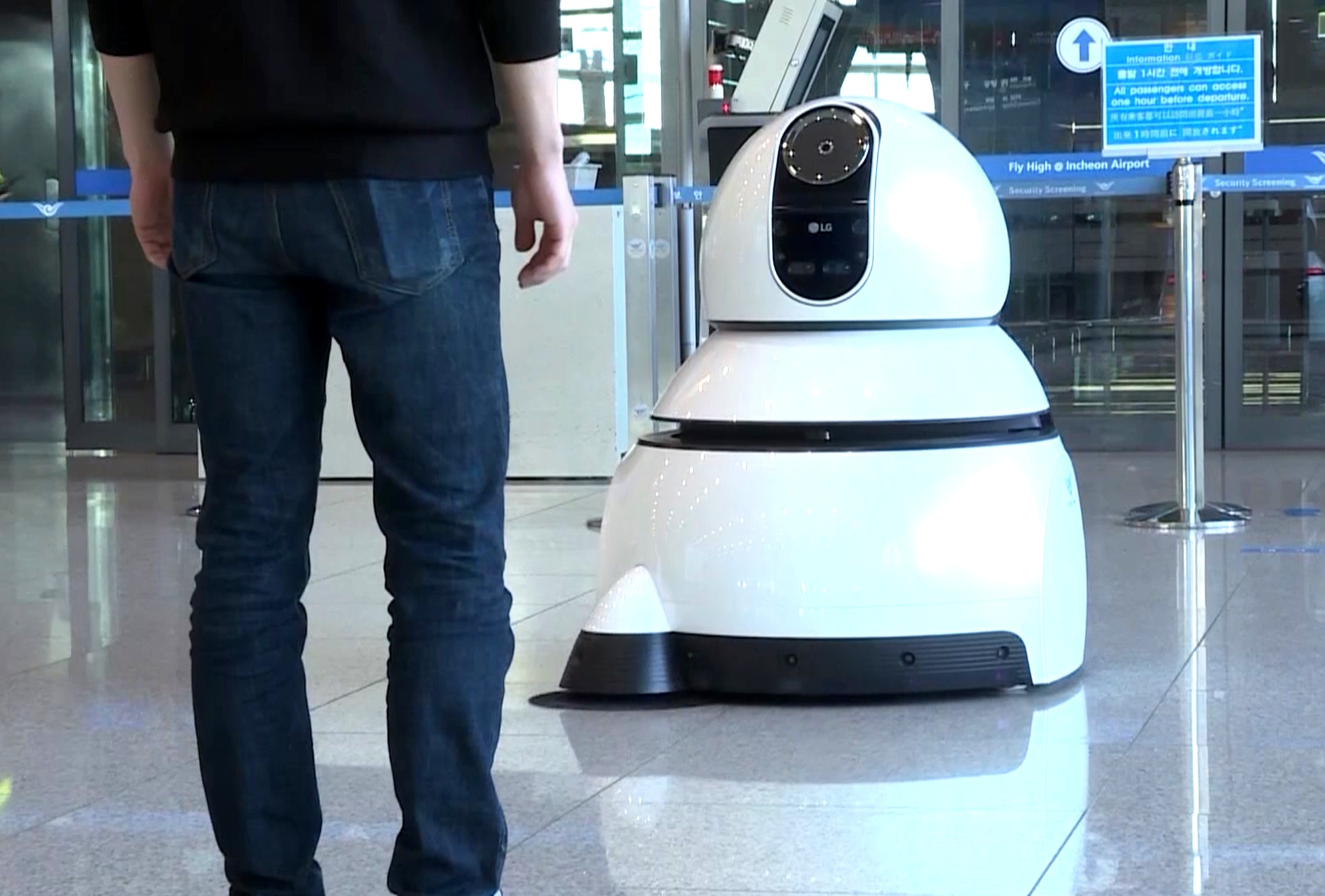 A front view of one of LG’s Airport Cleaning Robots in action at the airport.