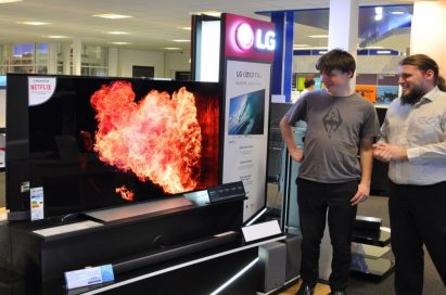 Visitors to LG’s IFA booth admiring an LG OLED TV and its incredible picture quality