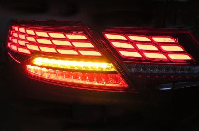 The same vehicle rear lamp displayed in the dark to show its brake and car indicator lights in action at the Frankfurt Motor Show.