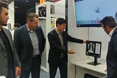 An LG representative demonstrates LG Medical Monitors to medical professionals at Medica 2017