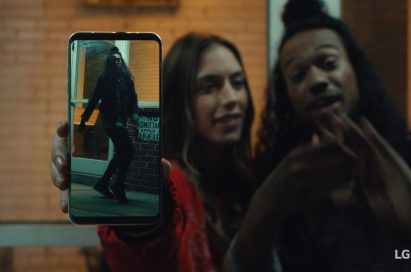 An image from the video clip shows Caroline Blaike standing next to Shaheem Sanchez while she holds LG V30 out towards the screen