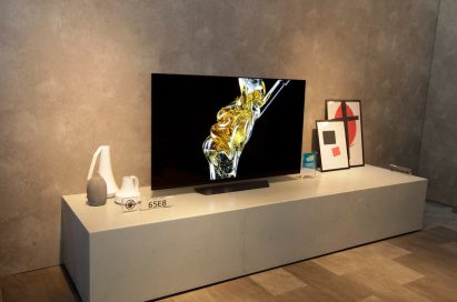 The LG OLED TV (model 65E8) displayed in the LG CES booth, a space designed to resemble a living room