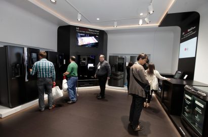 CES attendees examine products and displays in the LG InstaView Door-in-Door Refrigerator zone