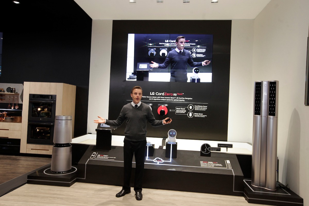 A staff member rehearses his demonstration of the connected home technology powered by LG’s ThinQ AI platform at LG’s CES booth.