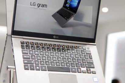 Closeup of the LG gram promotional stand at CES 2018, with two LG gram laptops back to back with the display open.