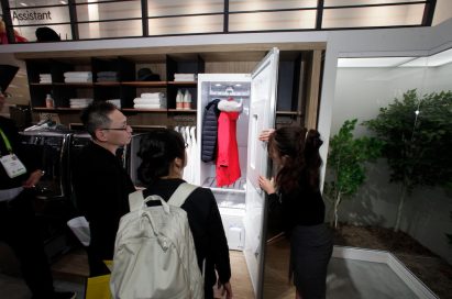 A woman demonstrates the powerful sanitizing capabilities of LG Styler at LG’s booth during CES 2018.