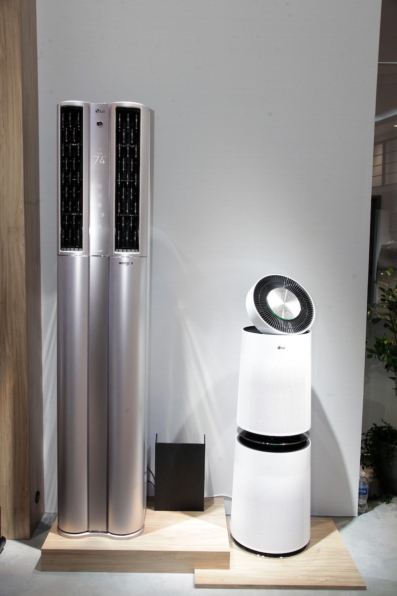 Front view of the LG DUALCOOL ThinQ™ Stand Inverter air conditioner and the LG PuriCare air purifier