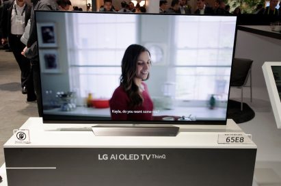 A closeup of the LG AI OLED TV ThinQ positioned on the promotional stand at the LG booth, CES 2018