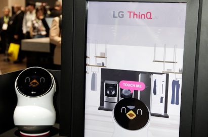 Front view of the LG CLOi Hub Robot and its touchscreen banner that introduces the key features of LG’s ThinQ AI platform and robots