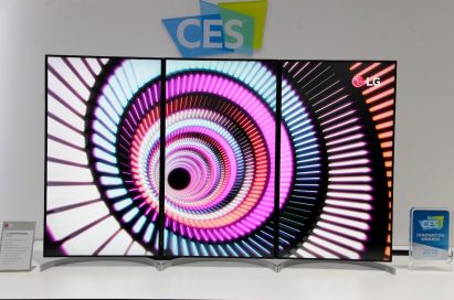 Front view of three 32-inch UltraFine Displays in their portrait mode to form one large 55-inch screen, which stands next to a 2018 CES Innovation Award