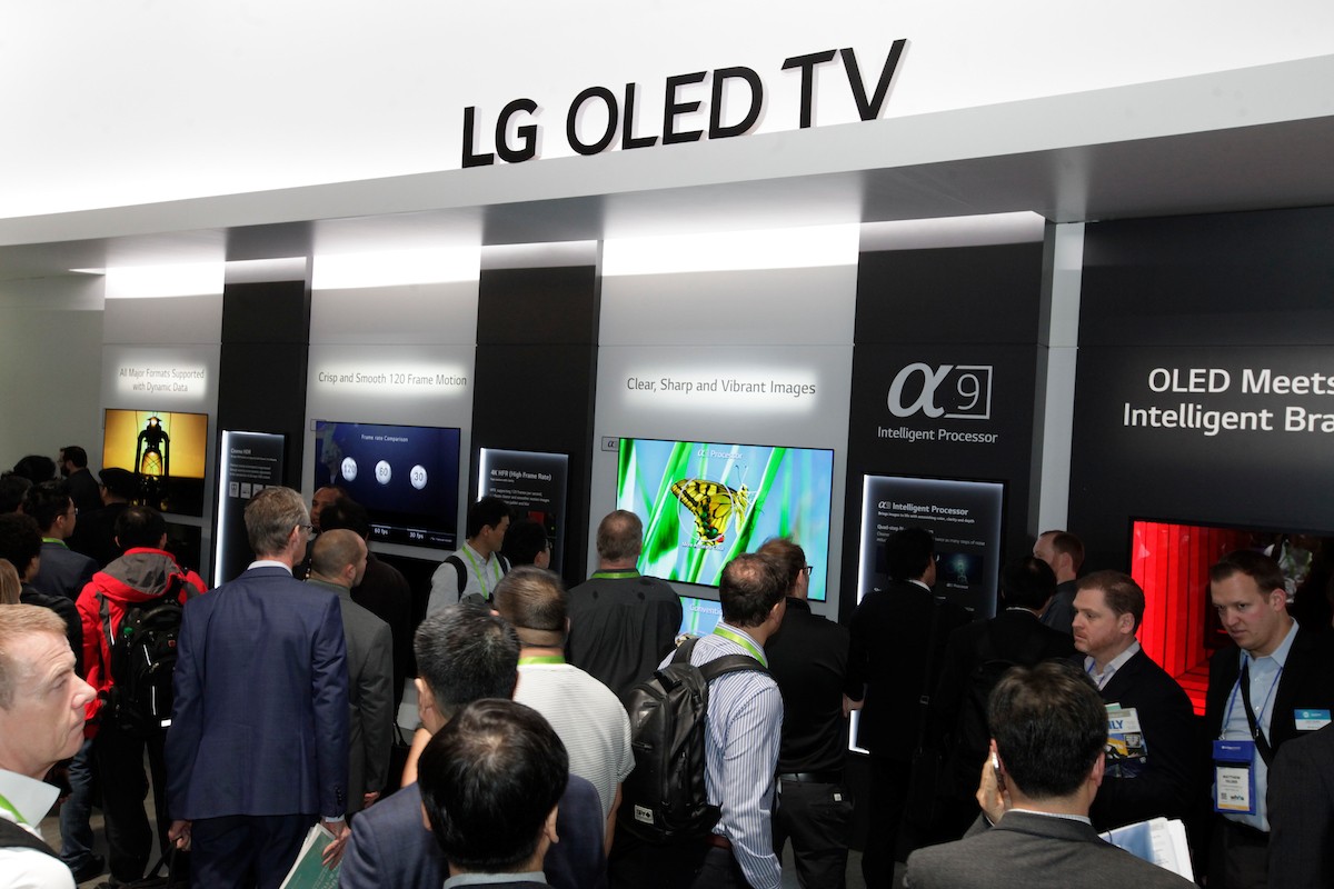 Many visitors taking a walk around the LG OLED TV zone of the company’s CES booth