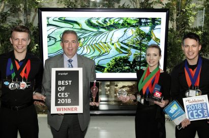 LG Electronics’ USA head of Product Marketing for Home Entertainment Products, Tim Alessi and models pose with awards from Engadget, T3, Techlicious and more, after LG won numerous Best TV product honors at CES 2018.