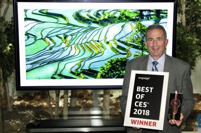 Tim Alessi, LG Electronics’ USA head of Product Marketing for Home Entertainment products, poses with two awards, one being Engadget’s Best of CES 2018 certificate.