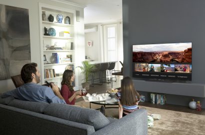 A family browse images on their AI-enabled LG TV in the living room