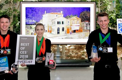 Models pose with the awards from Engadget, T3, Techlicious and more after LG won Best TV product honors at CES 2018.