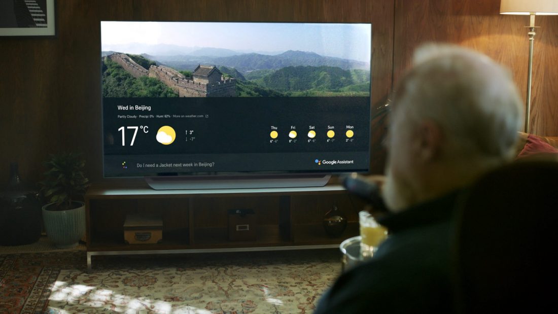 An old man asks LG's ThinQ-enabled TV for the weather forecast of Beijing for his travel.