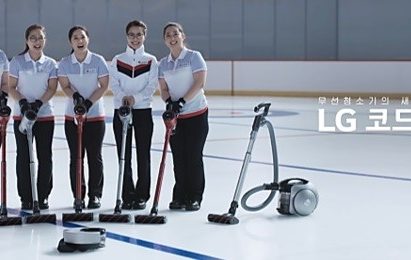South Korea’s women curlers, known as “Team Kim” stands abreast with LG CordZero vacuum cleaners in front.