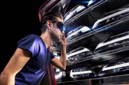 A model poses wearing VR goggles.