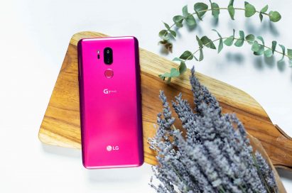 The LG G7 ThinQ in Raspberry Rose face down on a cutting board