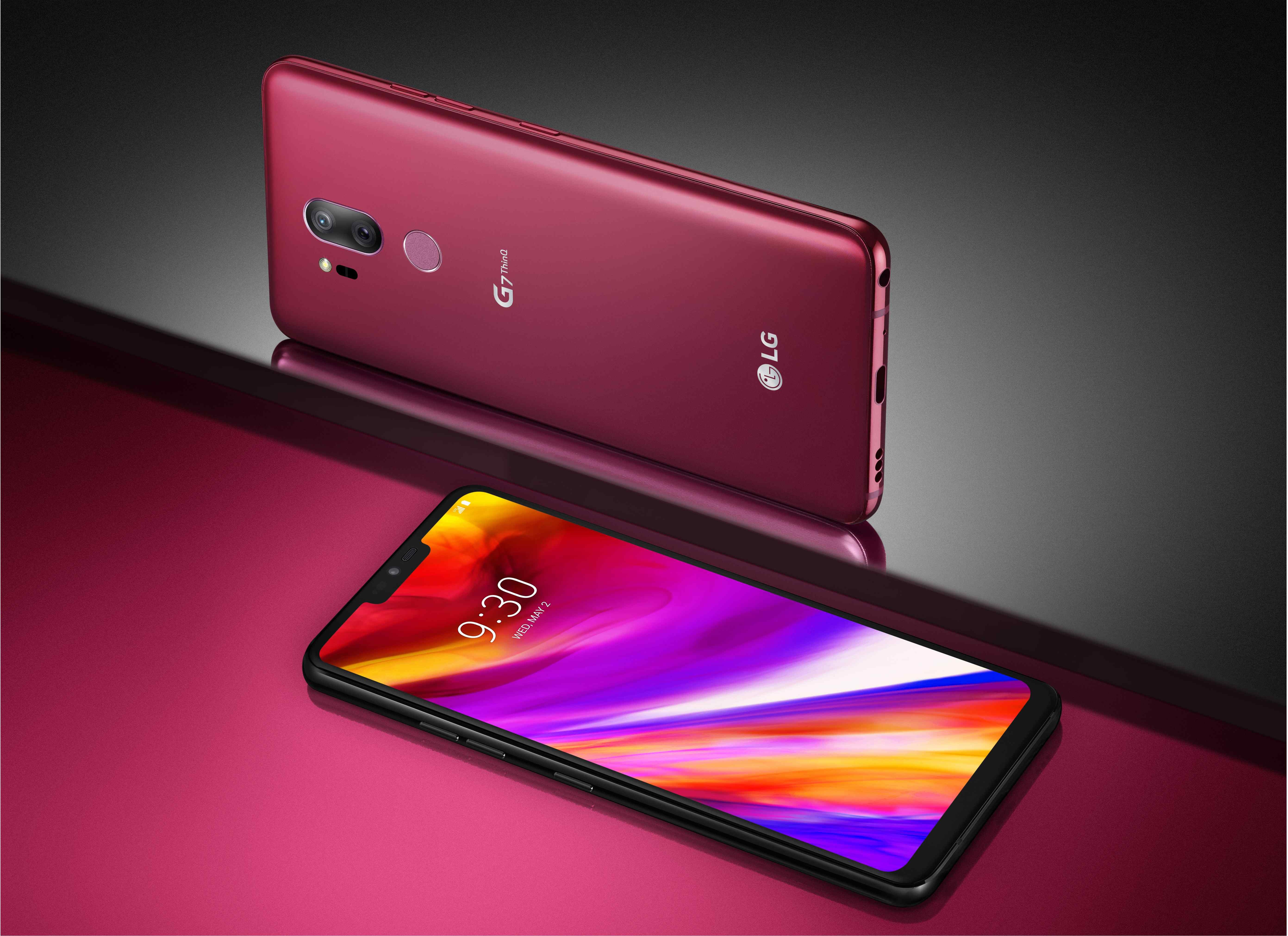 The front and rear view of the LG G7 ThinQ in Raspberry Rose against a gray and pink background