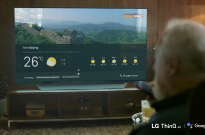 An elderly man checks the weather on his AI-enabled LG TV