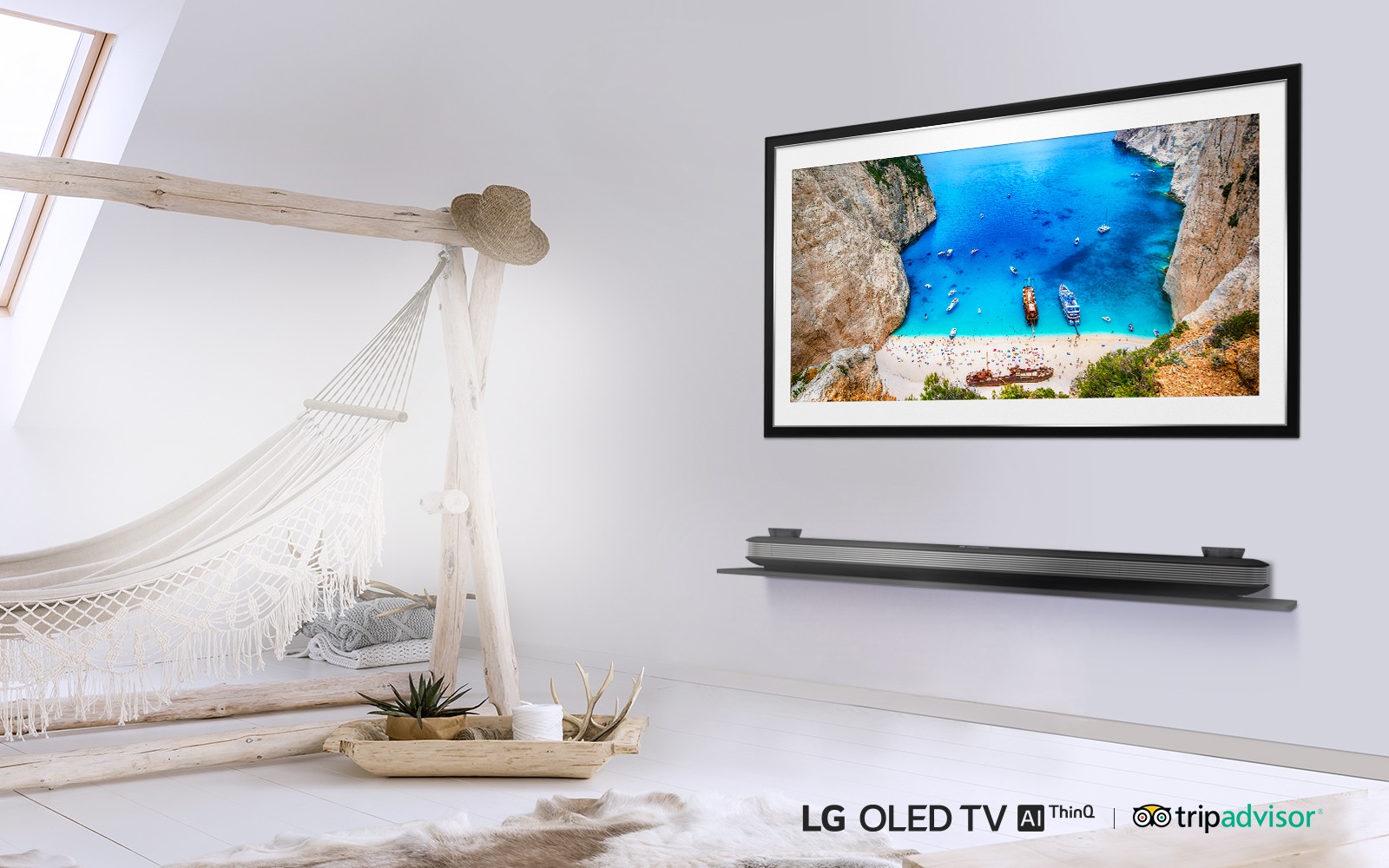 LG SIGNATURE OLED TV W in a room with a hammock displaying an image of boats on the coast of a rocky island.